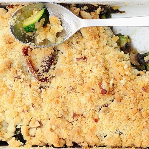 Courgette crumble with raw ham and mushrooms