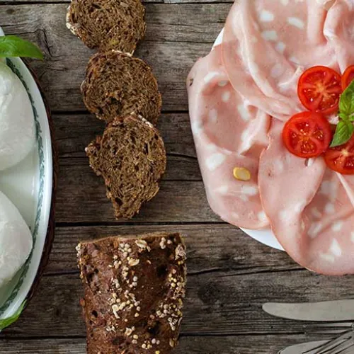 Delicious Caprese salad with tomato, mozzarella and mortadella