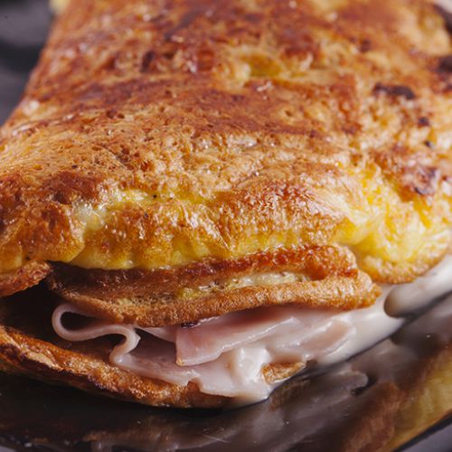 Savoury crepes with cooked ham and scamorza cheese