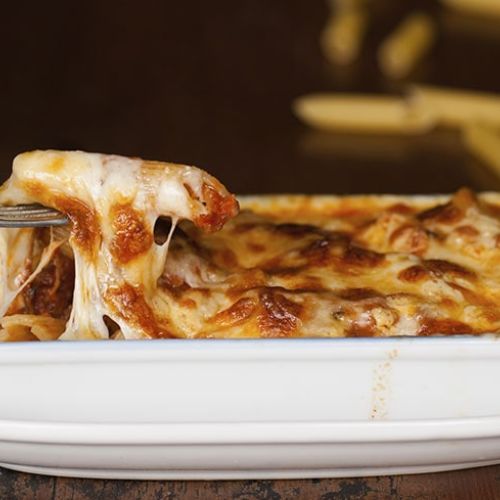 Oven-baked rigatoni pasta with mozzarella and bacon